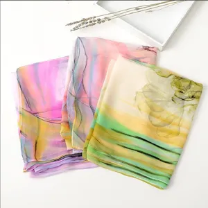 Beautiful printed chiffon scarf for women, soft summer beach shawl and sun protection accessory.