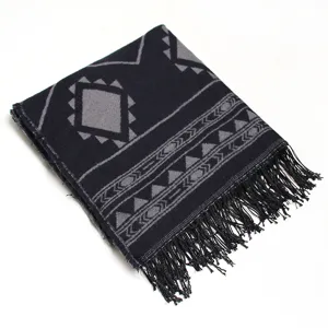 Detailed view of the cozy knitted winter shawl scarf featuring classic geometric patterns and fringe.