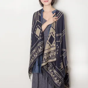 Detailed view of the women's geometric print fringed shawl cape, cozy winter knitwear scarf.