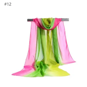 Vibrant gradient chiffon scarf detail showcasing lightweight pink, green and yellow fabric.