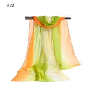 Detailed view of women's gradient chiffon scarf, colorful lightweight sun protection wrap.