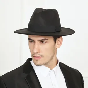 Men black fedora hat closeup showing wide brim design and classic gentleman jazz style.