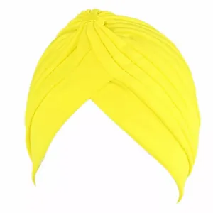 Close-up detail of yellow pleated turban headwrap showing soft cotton crossover texture.