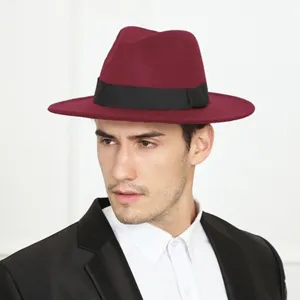 Detailed view of wine red fedora hat with black band, premium felt material close-up shot.