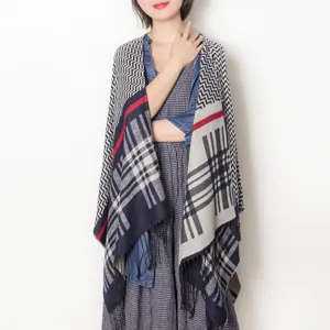 Detailed view of the stylish plaid fringe poncho shawl, perfect for autumn and winter seasons.