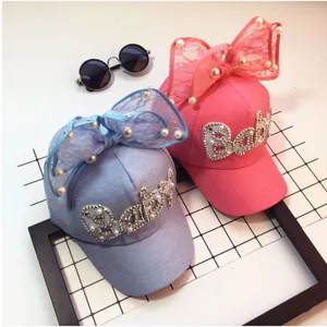 Kids mesh baseball cap detail showing rhinestone bow and breathable fabric for summer.