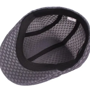 Grey mesh flat cap interior detail showing breathable fabric, inner lining and size tag.