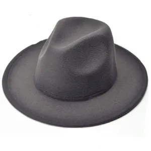 Close-up detail of a dark grey felt fedora hat, showing the fine texture and wide brim style.