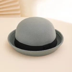 Gray felt bowler hat for women and men, classic dome design with black ribbon, retro style.
