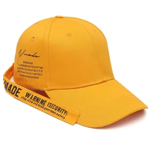 Close-up of vibrant yellow baseball cap featuring long strap and stylish English letter prints.