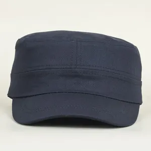 Detail view of a navy blue military flat top cadet cap, showing structured brim and clean stitching.