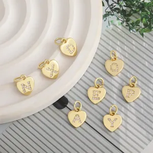Gold plated heart letter charms with cubic zirconia, perfect for DIY jewelry making and bracelets.