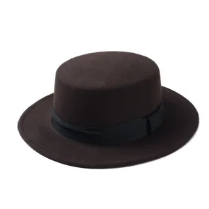 Close-up detail of a classic dark brown flat top fedora hat with a black ribbon band.