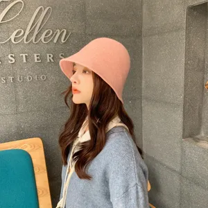 Pink knitted bucket hat for women, soft winter wool fisherman cap, sweet casual style daily wear.