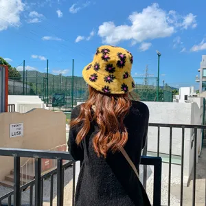 Plush flower bucket hat detail view, warm winter fuzzy hat, cute casual streetwear style.