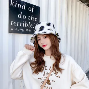 Cozy fluffy bucket hat detail, cute black and yellow daisy pattern, soft winter daily wear.