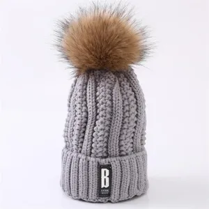 Gray Knitted Beanie Hat with Large Faux Fur Pom Pom Winter Warm Detail Close Up