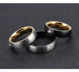 Men's minimalist stainless steel ring with stone inlay, brushed finish and gold inner band.