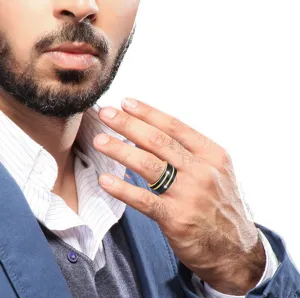 Close-up detail showing the black stainless steel men ring with gold lines and stones.