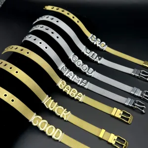 Stainless steel mesh strap bracelet detail with letter charms, fashion metal jewelry accessory.