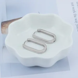 Minimalist stainless steel oval hoop earrings for women, simple and chic daily jewelry.