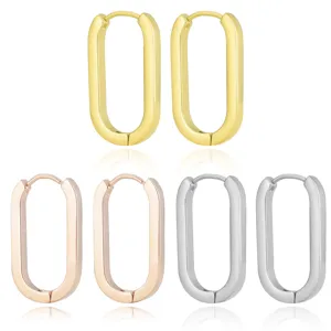 Minimalist stainless steel oval hoop earrings in gold, rose gold, and silver finishes.