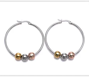 Stainless steel hoop earrings featuring triple-tone beads in gold, silver, and rose gold.