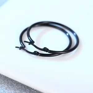Black stainless steel hoop earrings for men and women, classic minimalist design.
