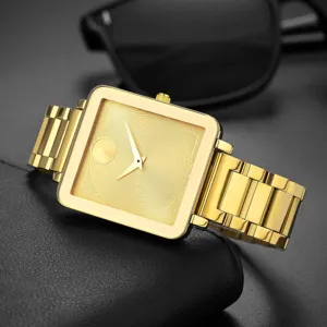 Gold square quartz watch detail featuring minimalist textured dial and steel band.