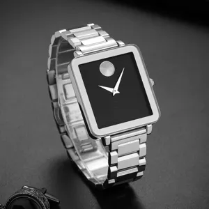 Detailed view of a minimalist square quartz watch with black dial and silver stainless steel strap.