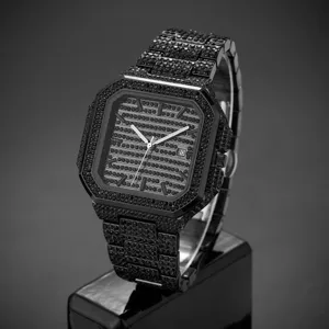 Close-up of a luxury black iced out square quartz watch featuring sparkling crystal paved dial.