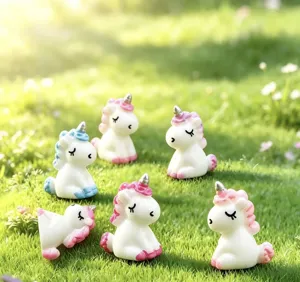 Close-up detail shot of cute resin unicorn miniature figurines for moss micro landscape decor.