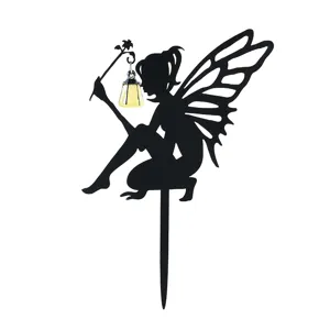 Black iron fairy garden stake with luminous lantern for outdoor lawn and yard decor.
