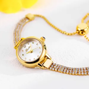 Elegant women's quartz watch with sparkling rhinestones, golden finish and adjustable strap.