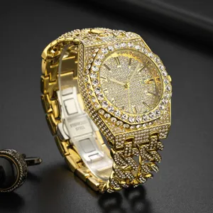 Close-up detail of luxury iced out gold quartz watch featuring shimmering rhinestones and cuban link.