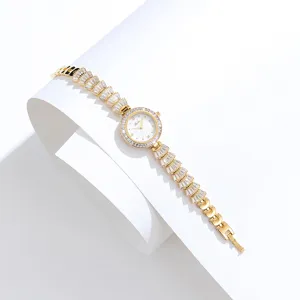 Elegant gold women's watch featuring sparkling rhinestone dial and unique fan-shaped link bracelet design.