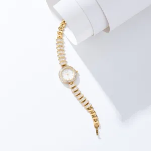 Detailed view of luxury gold women rhinestone quartz watch with unique crystal bracelet strap.