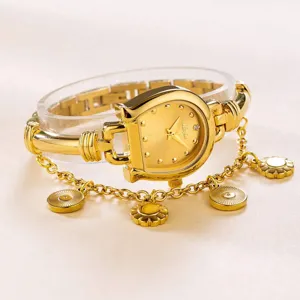 Close-up detail of the elegant gold horseshoe quartz watch showcasing its unique charm chain.