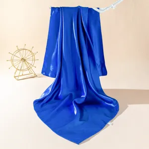 Royal blue silk square scarf, smooth satin fabric texture, elegant detail display for women