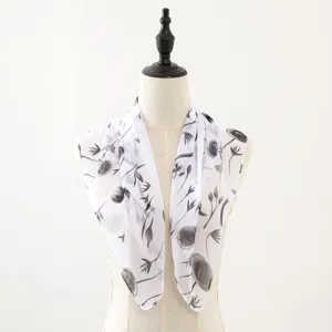 White chiffon square scarf with black floral print, elegant spring and summer neck accessory.