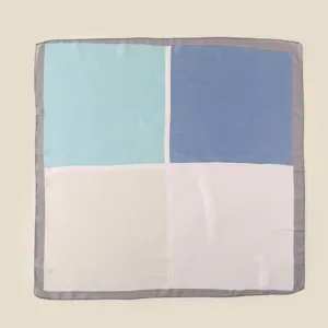 Detailed view of the Korean color block square scarf showing its four-color geometric design.