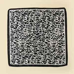 Black and white animal print square scarf featuring a solid black border for women.