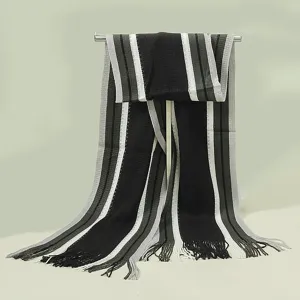 Close-up view of the knitted striped scarf detail, featuring black, white and grey color blocks.