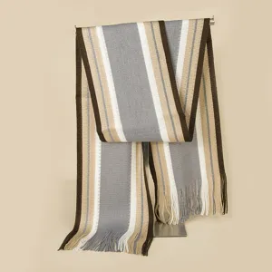Detailed view of the cozy knitted striped scarf with fringe, showing texture and color mix.