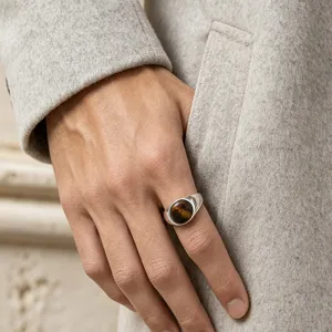 Close-up detail of the vintage tiger eye stone ring featuring a polished stainless steel band.