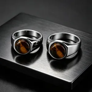 Close-up detail of stainless steel men's ring featuring natural tiger eye stone inlay.