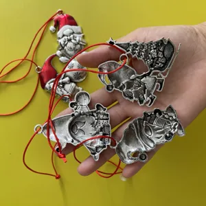 Metal Christmas tree ornaments set featuring Santa Claus and gnome designs with red hanging strings.