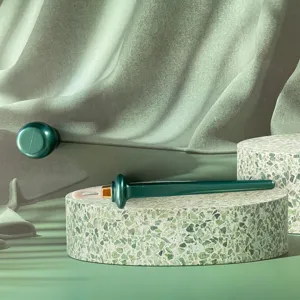 Silicone eyeliner tool detail view, green makeup brush applicator for precise waterproof eye makeup.