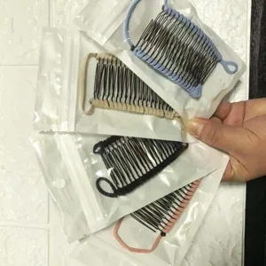 Detailed view of plastic banana hair clips, double comb styling tools in four colors.