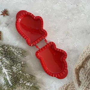 Red Christmas mitten shaped pastry mold, perfect for baking holiday cookies and fruit pies.
